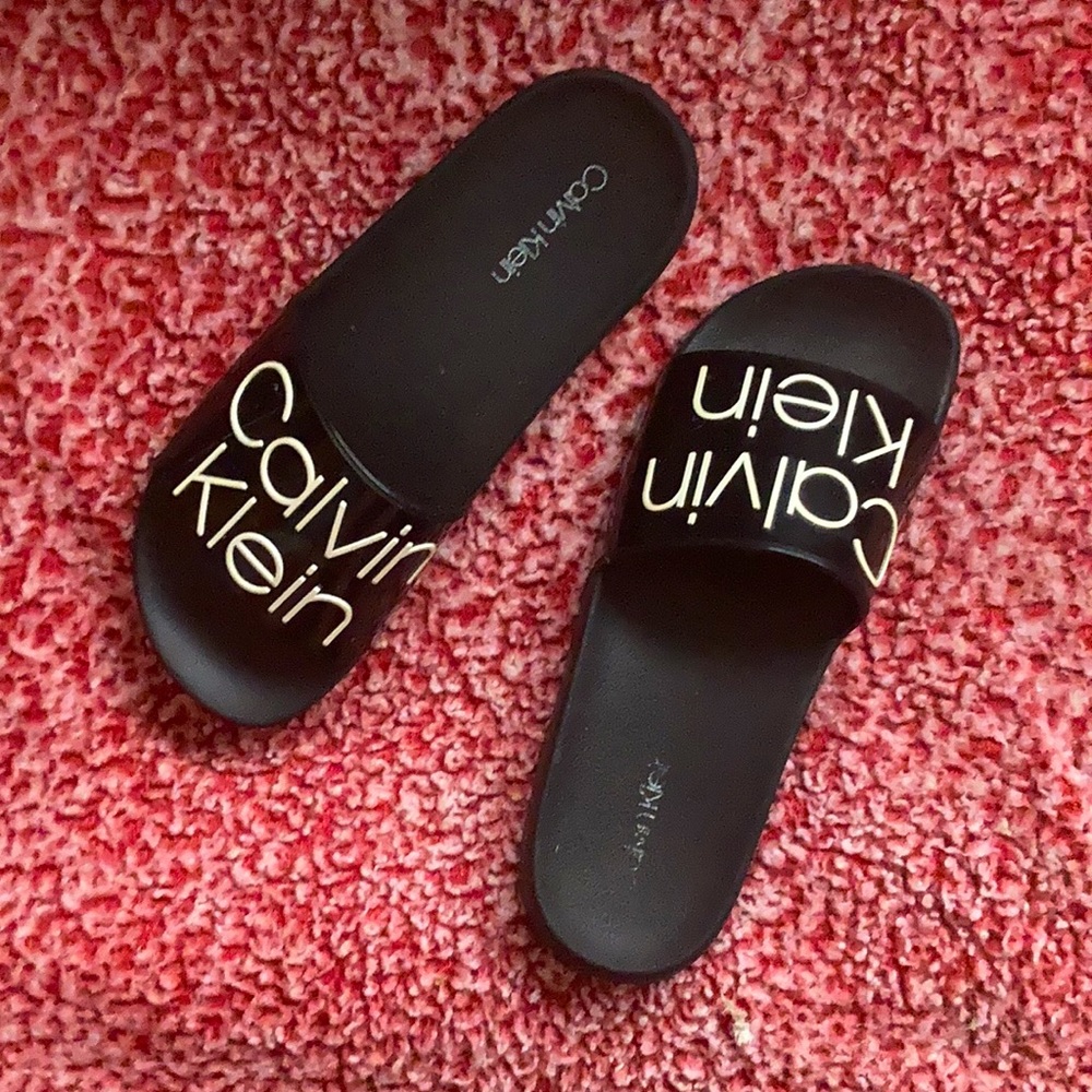 Black and white Calvin Klein slides